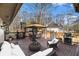 Outdoor patio area with furniture, grill, and wooded views at 2984 Superior Dr, Dacula, GA 30019