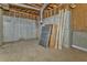 Unfinished basement featuring concrete walls, exposed wood framing, and a concrete floor at 322 Corley Cir, Hiram, GA 30141