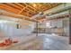 Unfinished basement with exposed rafters and concrete floor at 322 Corley Cir, Hiram, GA 30141