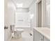 Bathroom featuring a soaking tub, shower, skylight, and gray vanity at 322 Corley Cir, Hiram, GA 30141