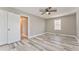 Spacious bedroom with modern flooring, neutral paint, natural light, and closet space at 322 Corley Cir, Hiram, GA 30141