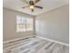 Neutral bedroom has vinyl plank flooring and natural light at 322 Corley Cir, Hiram, GA 30141