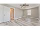 Bedroom with hardwood floors, a ceiling fan, and natural lighting at 322 Corley Cir, Hiram, GA 30141