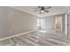 Spacious bedroom with modern flooring, neutral paint, natural light, and walk-in closet at 322 Corley Cir, Hiram, GA 30141
