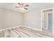 Neutral bedroom with vinyl plank flooring, a ceiling fan, and a closet at 322 Corley Cir, Hiram, GA 30141