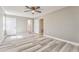 Spacious bedroom with modern flooring, neutral paint, natural light, and multiple closets at 322 Corley Cir, Hiram, GA 30141