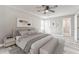 Stylishly furnished bedroom with a king bed, neutral decor, and an accent wall with artwork at 322 Corley Cir, Hiram, GA 30141