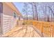 Wood deck with natural surroundings, sliding glass door, and wood railing at 322 Corley Cir, Hiram, GA 30141