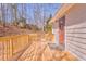 Wood deck featuring wood railing, natural surrounding, and access to the residence at 322 Corley Cir, Hiram, GA 30141