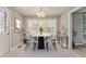 Dining area with modern table set and abundant natural light at 322 Corley Cir, Hiram, GA 30141