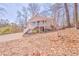 View of the front of the house with a porch, staircase, and natural surroundings at 322 Corley Cir, Hiram, GA 30141