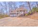 Charming split-level home with a two-car garage and inviting front porch at 322 Corley Cir, Hiram, GA 30141