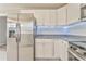 Kitchen with stainless steel refrigerator, white cabinets, modern countertop, and stainless steel appliances at 322 Corley Cir, Hiram, GA 30141