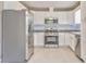 Kitchen with stainless steel refrigerator, white cabinets, modern countertop, and stainless steel appliances at 322 Corley Cir, Hiram, GA 30141
