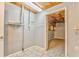 The laundry room features tile flooring, shelving, and access to the adjacent room at 322 Corley Cir, Hiram, GA 30141