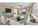 Stylish living room featuring a stone fireplace and modern furnishings at 322 Corley Cir, Hiram, GA 30141