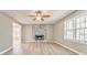 Bright living room with stone fireplace, modern flooring and abundant natural light at 322 Corley Cir, Hiram, GA 30141