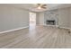 Bright living room with stone fireplace, modern flooring and abundant natural light at 322 Corley Cir, Hiram, GA 30141