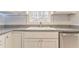 Kitchen sink with stylish faucet and countertop with subway tile backsplash and overhead lighting at 322 Corley Cir, Hiram, GA 30141