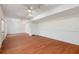 Large basement features hardwood floors, white walls and trim, and recessed lighting and ceiling fan at 2162 Pine Mountain Nw Rd, Kennesaw, GA 30152