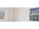 Bright bedroom featuring two windows with wooded outdoor views at 2162 Pine Mountain Nw Rd, Kennesaw, GA 30152