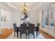 Elegant dining room featuring a chandelier, wainscoting, and hardwood floors at 2162 Pine Mountain Nw Rd, Kennesaw, GA 30152