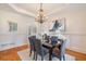 Formal dining area with modern lighting, hardwood floors, and wainscoting at 2162 Pine Mountain Nw Rd, Kennesaw, GA 30152