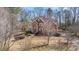 Charming two-story brick home with an arched entryway and manicured landscaping in a wooded neighborhood at 2162 Pine Mountain Nw Rd, Kennesaw, GA 30152