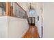 Grand foyer with hardwood floors, staircase, and large window above double doors at 2162 Pine Mountain Nw Rd, Kennesaw, GA 30152