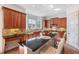 Well-lit kitchen features granite countertops, wood cabinets, and bar seating at 2162 Pine Mountain Nw Rd, Kennesaw, GA 30152