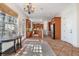 Spacious kitchen area with tile floors, stainless steel appliances, wooden cabinetry, and a chandelier at 2162 Pine Mountain Nw Rd, Kennesaw, GA 30152