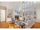Bright living room featuring a fireplace, large windows, hardwood floors and built-in bookshelves at 2162 Pine Mountain Nw Rd, Kennesaw, GA 30152