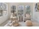 Sitting area with light colored furniture, neutral walls, carpet, large windows, and lots of natural light at 2162 Pine Mountain Nw Rd, Kennesaw, GA 30152