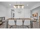 Stylish dining room with a chic light fixture and views of adjacent spaces at 2850 Stonehall Se Ct, Smyrna, GA 30080