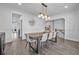 Open dining area featuring a modern light and seamless flow to other living spaces at 2850 Stonehall Se Ct, Smyrna, GA 30080