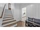 Bright entryway with hardwood stairs and a storage bench at 2850 Stonehall Se Ct, Smyrna, GA 30080