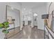 Bright entryway featuring hardwood floors and a large mirror accent at 2850 Stonehall Se Ct, Smyrna, GA 30080