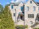 Charming brick townhome with well-manicured landscaping and a welcoming entrance at 2850 Stonehall Se Ct, Smyrna, GA 30080