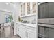 Kitchen featuring white cabinets and sleek countertops with stainless steel appliances at 2850 Stonehall Se Ct, Smyrna, GA 30080
