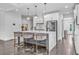 Eat-in kitchen island with pendant lights and stainless appliances at 2850 Stonehall Se Ct, Smyrna, GA 30080