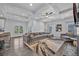 Open living room featuring coffered ceilings and gray sectional sofa at 2850 Stonehall Se Ct, Smyrna, GA 30080