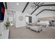 Main bedroom showcasing beams, vaulted ceilings, sitting area, and modern decor at 2850 Stonehall Se Ct, Smyrna, GA 30080