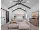 Beautiful main bedroom boasts high ceilings with beams, barn door, and sitting area at 2850 Stonehall Se Ct, Smyrna, GA 30080