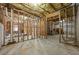 Unfinished basement featuring framed walls, visible ductwork, and concrete flooring at 4012 Grand Park Ne Dr, Suwanee, GA 30024