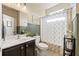 Well-lit bathroom features tile floors, stylish decor and updated vanity and faucet at 4012 Grand Park Ne Dr, Suwanee, GA 30024