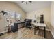 Bright bedroom featuring a keyboard, computer setup, and two large windows with natural light at 4012 Grand Park Ne Dr, Suwanee, GA 30024