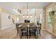 Bright and airy dining room with high ceilings and an open view of the living room at 4012 Grand Park Ne Dr, Suwanee, GA 30024