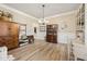 Elegant dining room with wood floors, classic furnishings, and decorative accents at 4012 Grand Park Ne Dr, Suwanee, GA 30024