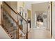 Spacious foyer featuring wood floors, staircase, and an inviting open entrance at 4012 Grand Park Ne Dr, Suwanee, GA 30024