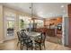 Inviting kitchen with wood cabinets, stainless appliances, island, and adjacent deck access at 4012 Grand Park Ne Dr, Suwanee, GA 30024